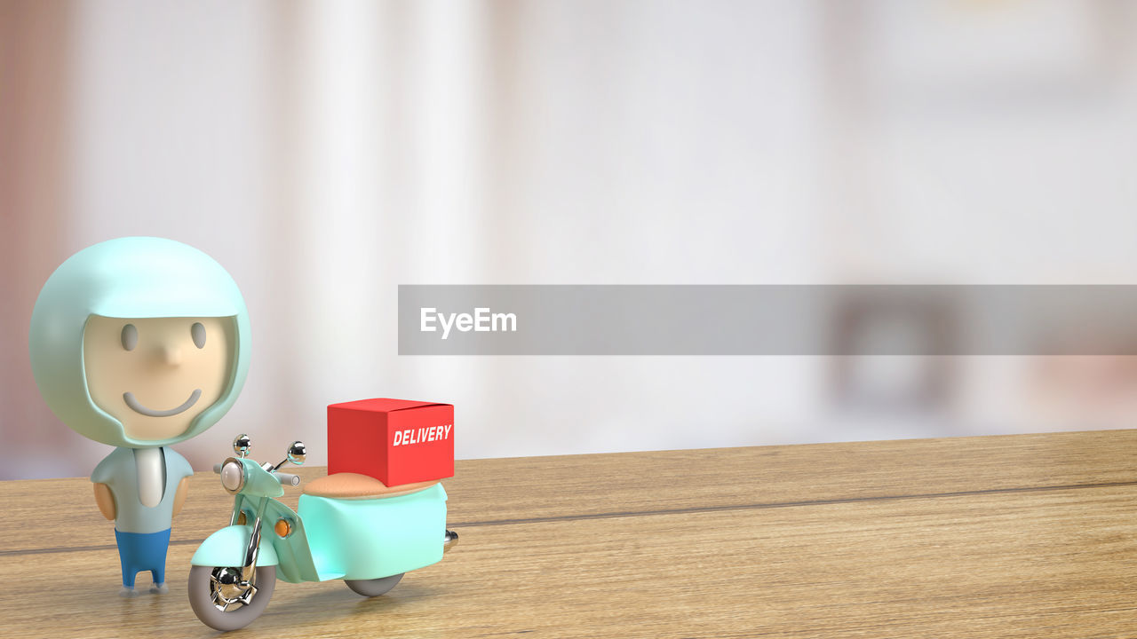 CLOSE-UP OF TOY ON TABLE