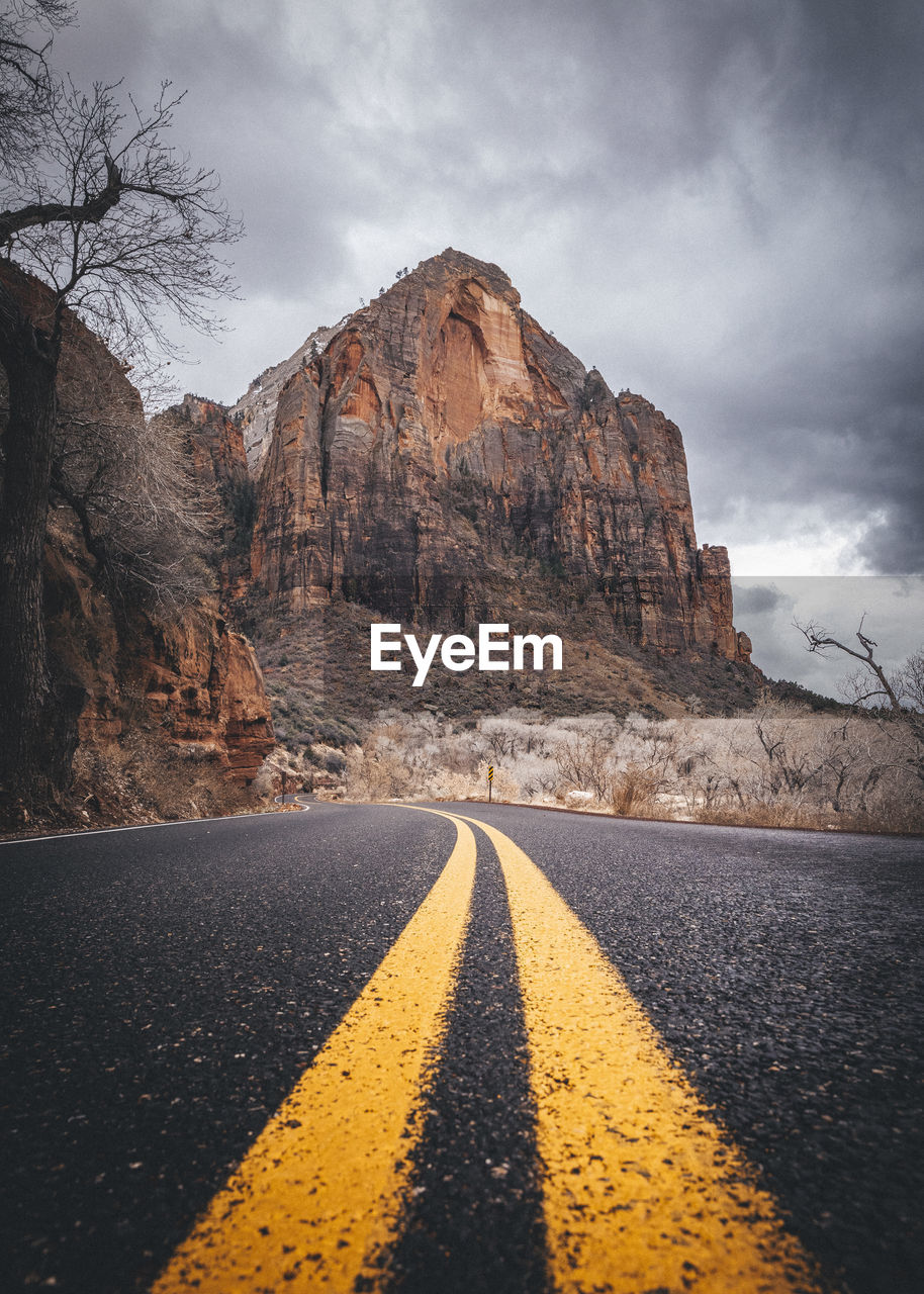 A road between mountains in zion national park, utah