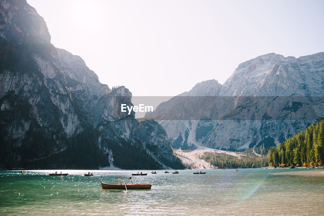 SCENIC VIEW OF LAKE AGAINST MOUNTAINS