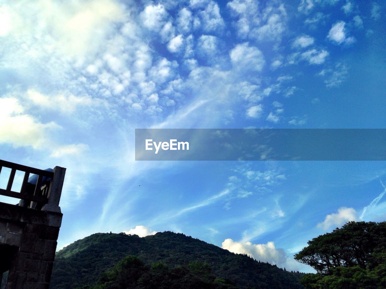 SCENIC VIEW OF MOUNTAINS AGAINST CLOUDY SKY