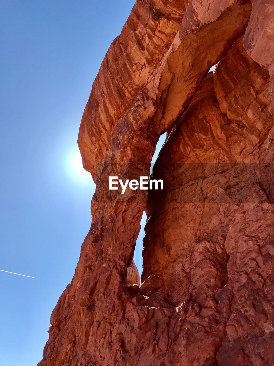 Low angle view of rock formation against sky