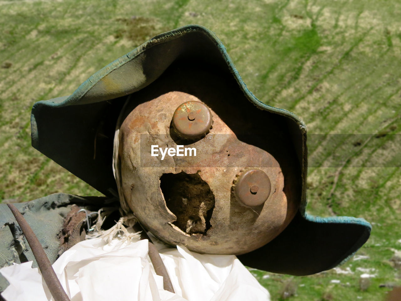 High angle view of cracked funny face in farm