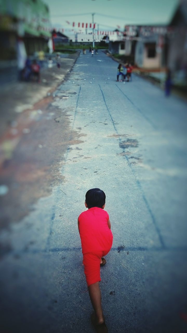 WOMAN STANDING ON ROAD