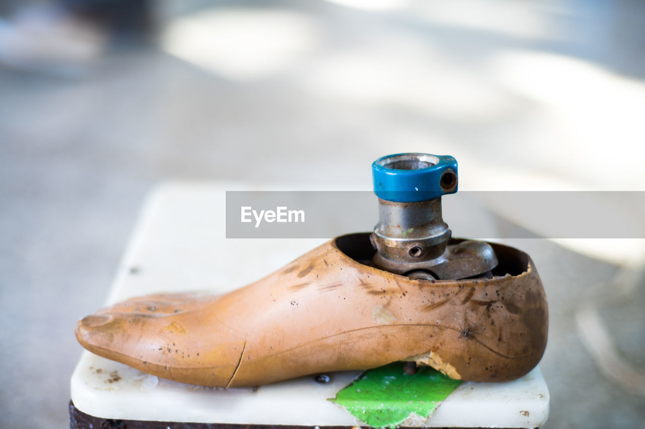 High angle view of faucet in container