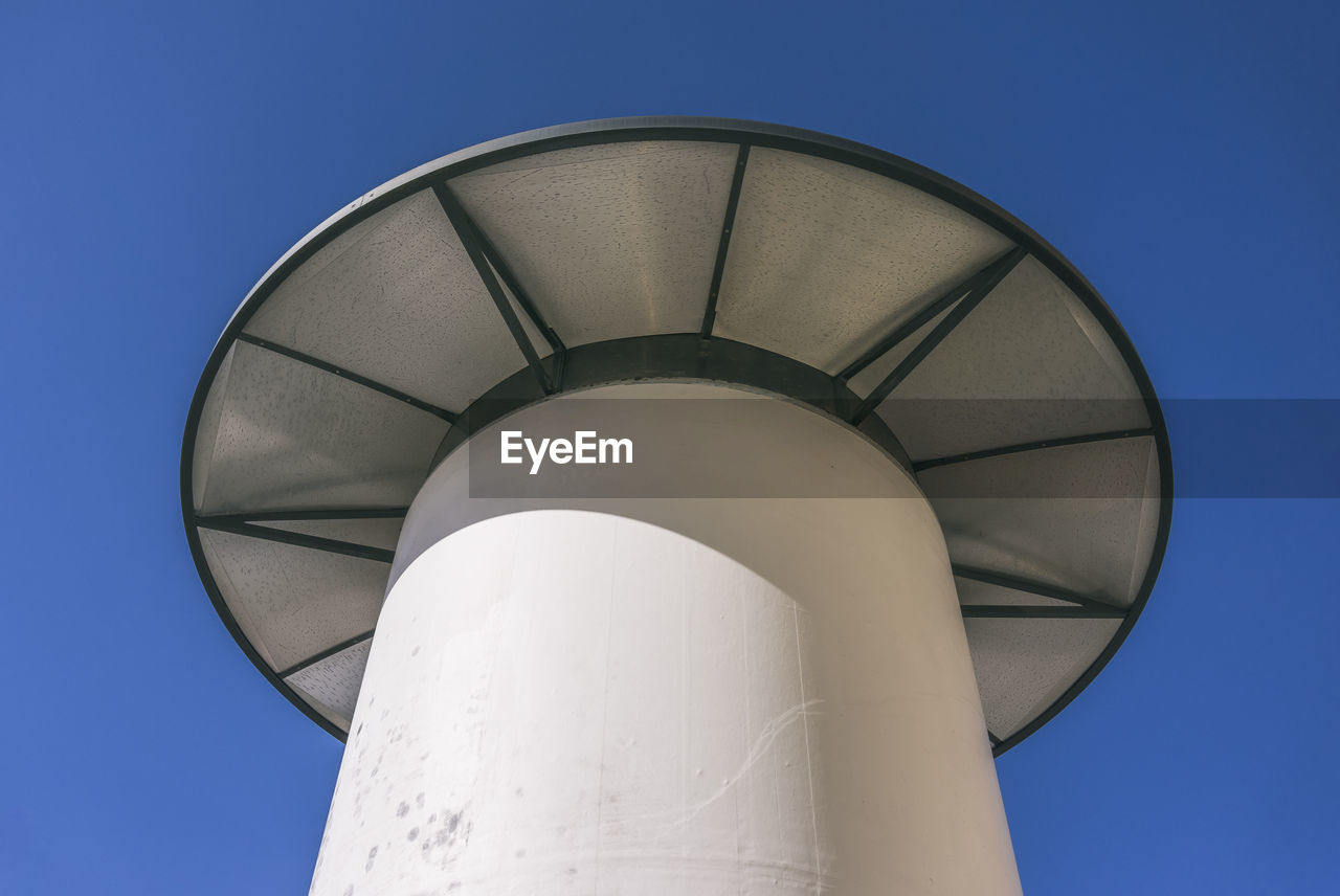 Low angle view of tower against clear blue sky