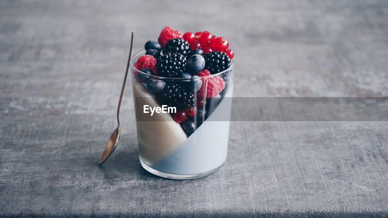 Close-up of drink with berry fruits on table