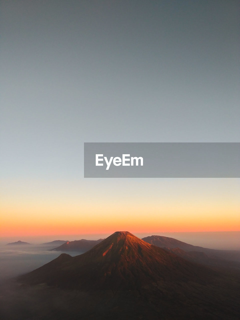 VIEW OF VOLCANIC MOUNTAIN DURING SUNSET