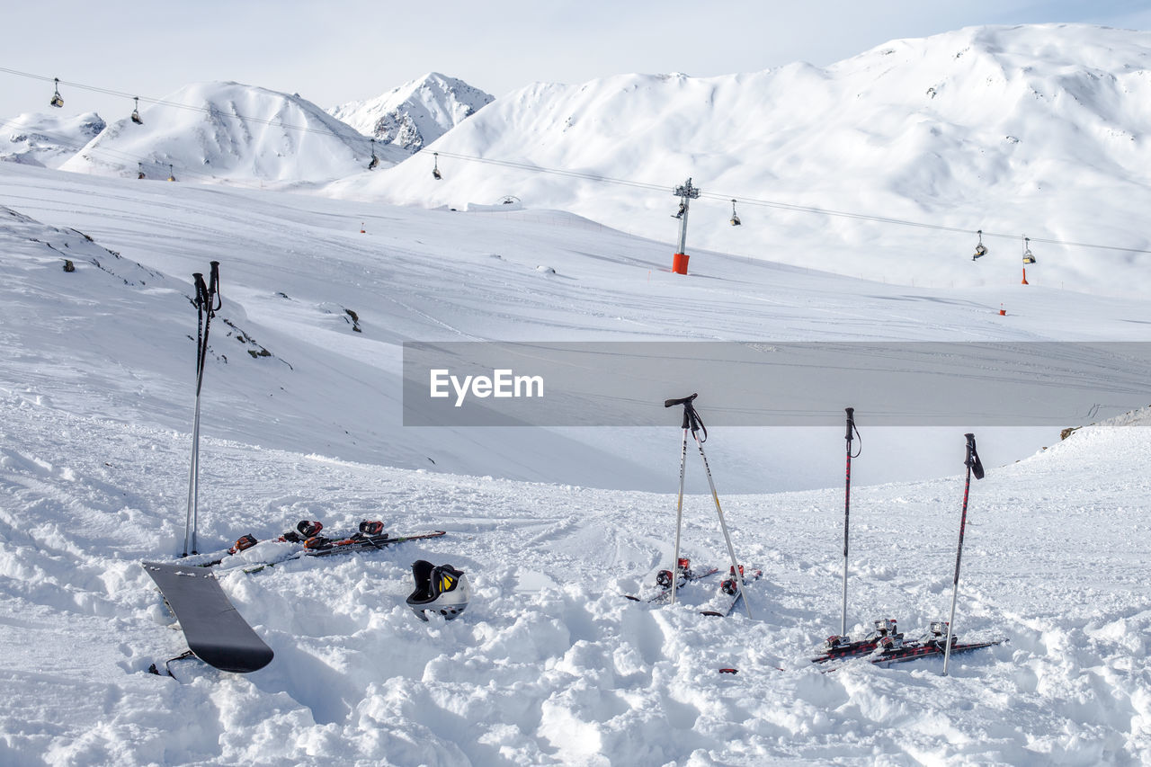 Overhead cable cars at snow covered landscape