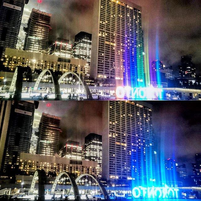 SKYSCRAPERS IN CITY AT NIGHT