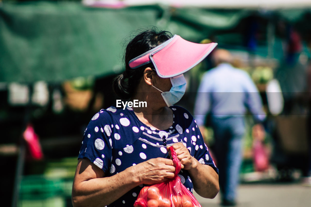 FULL LENGTH OF WOMAN WEARING MASK