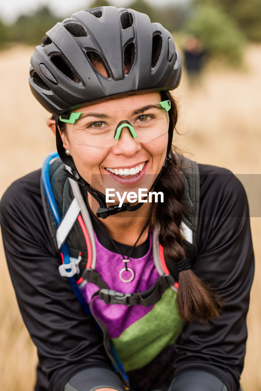 Portrait of smiling female mountain biker