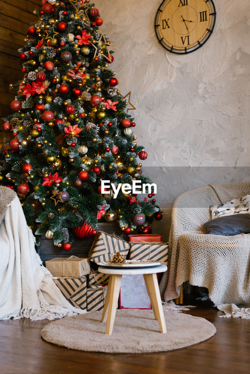 Stylish classic interior of a country house with a christmas tree