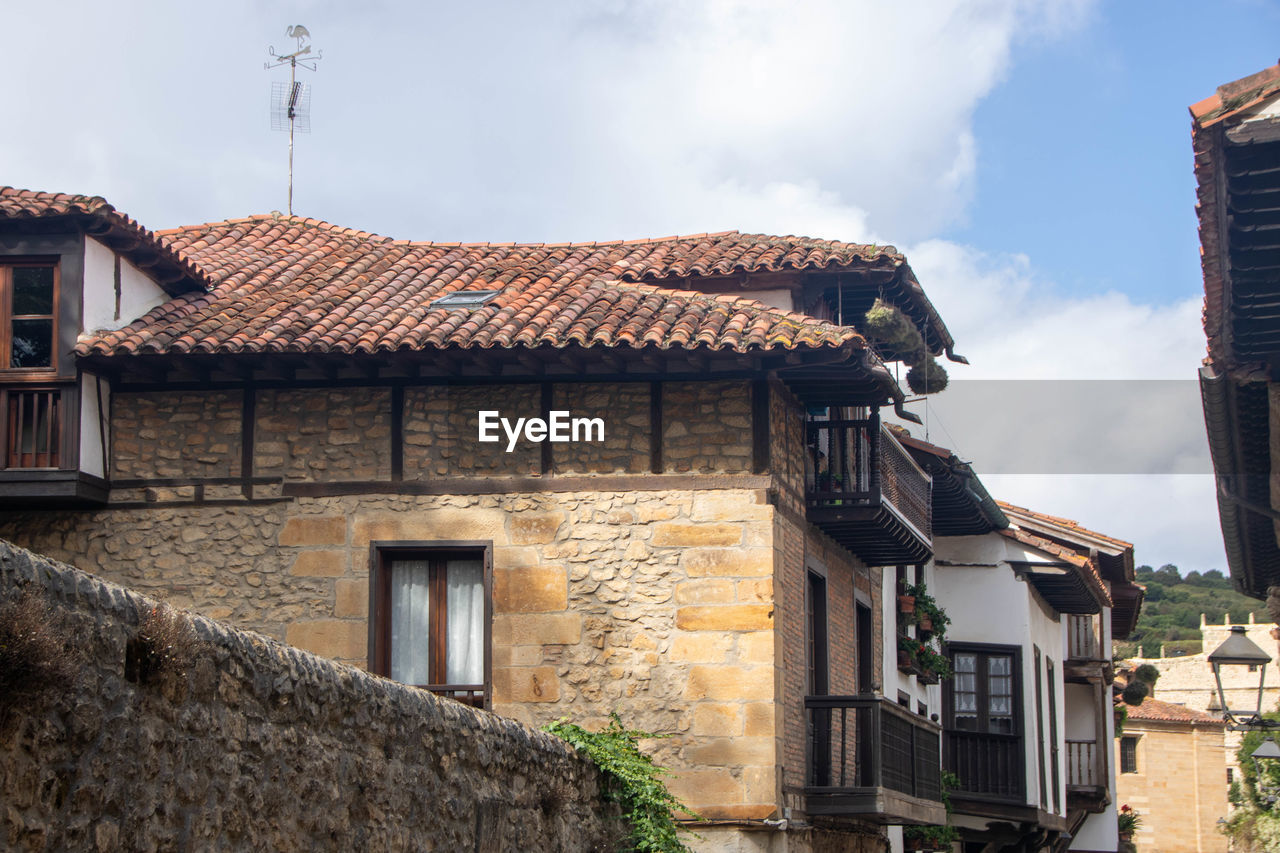 houses in city against sky