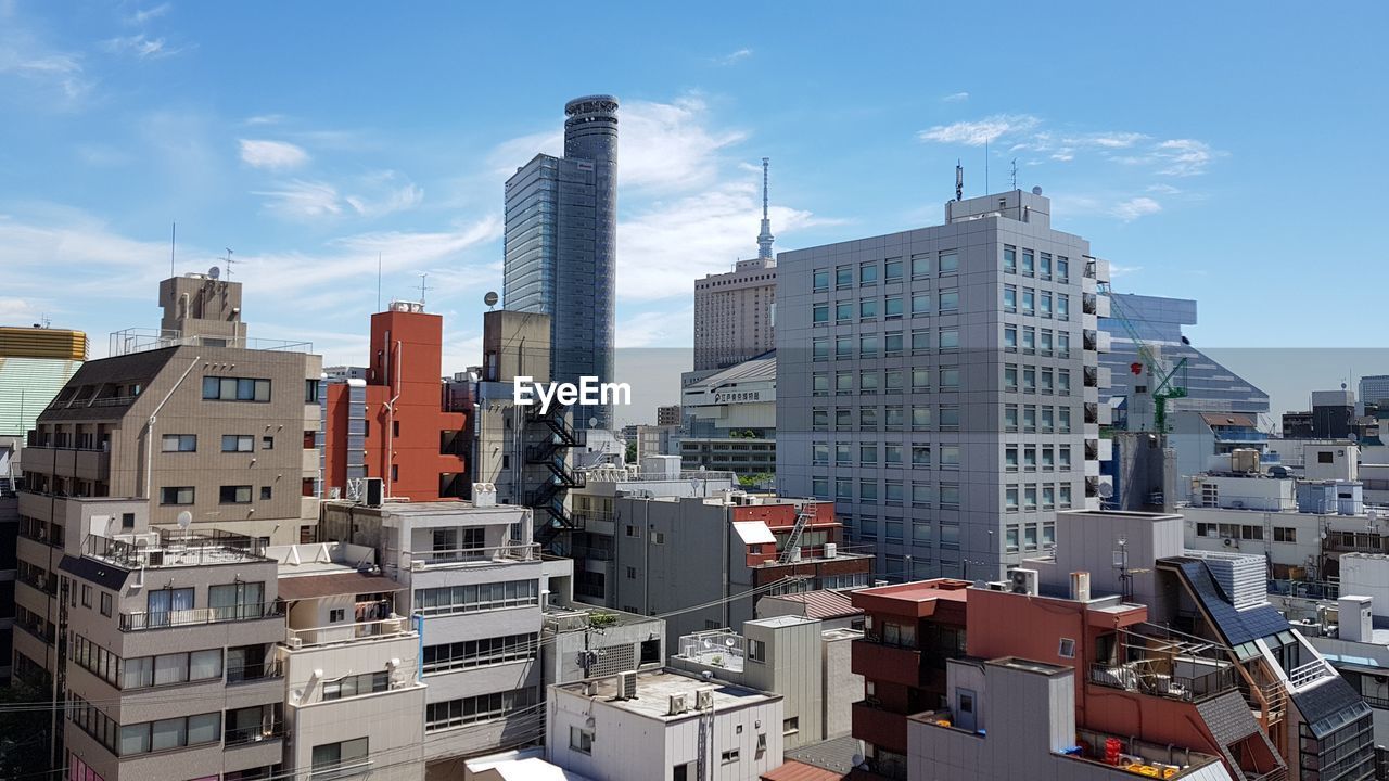 Modern buildings in city against sky