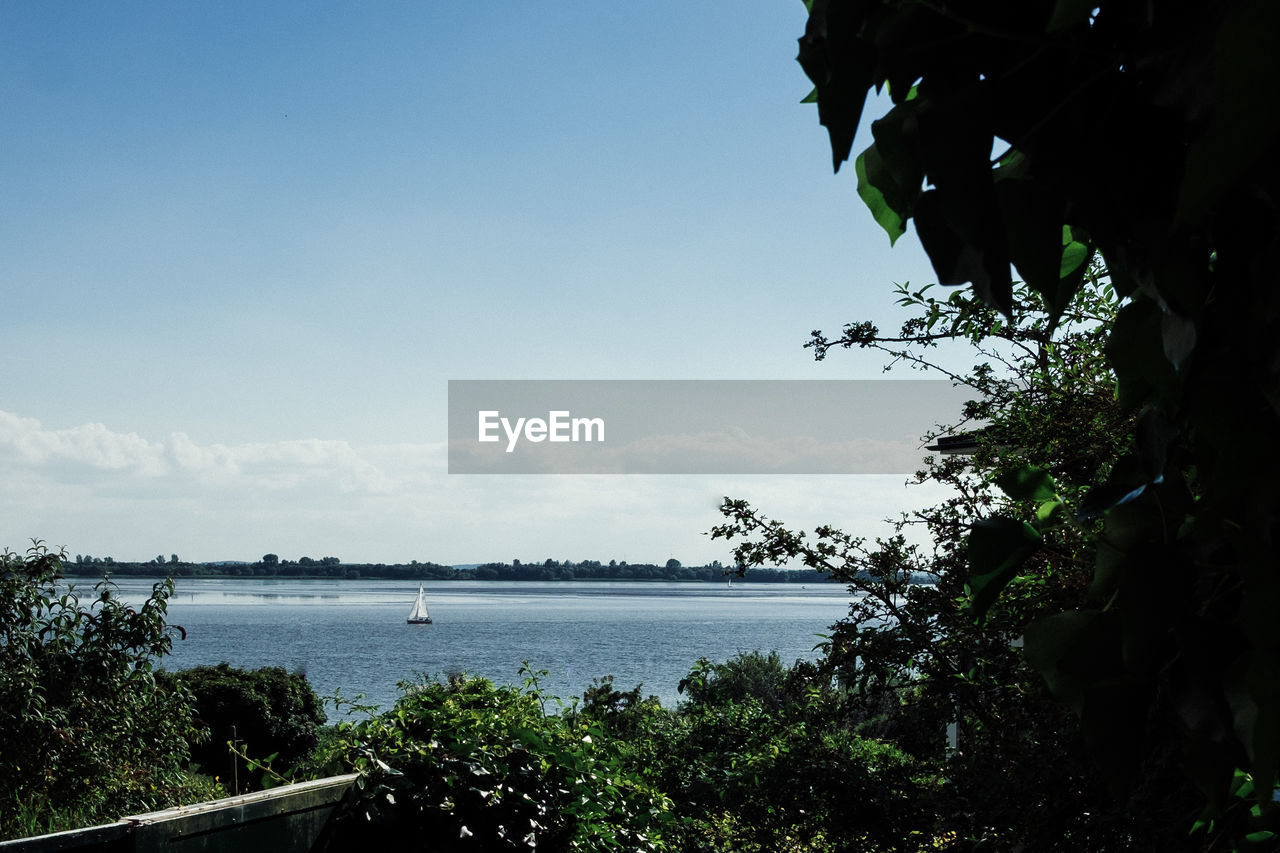 Scenic view of beach and sea against sky