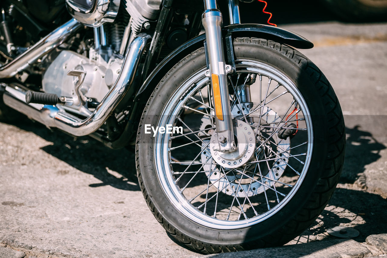 cropped image of motorcycle on road