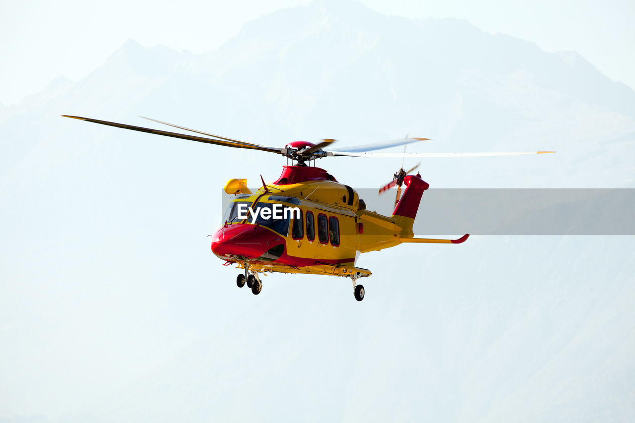 View of helicopter flying in sky