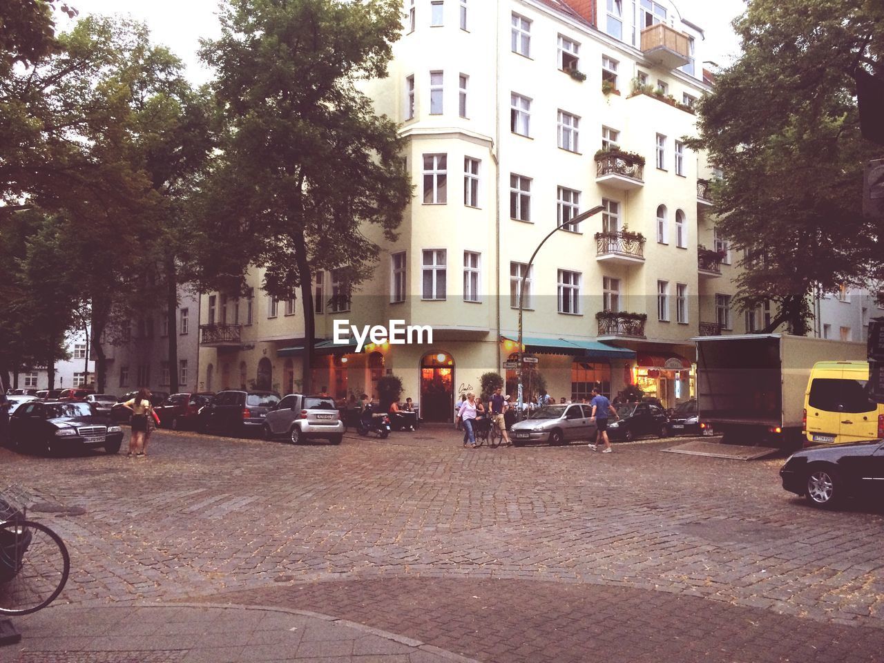 PARKED CARS IN FRONT OF BUILDINGS