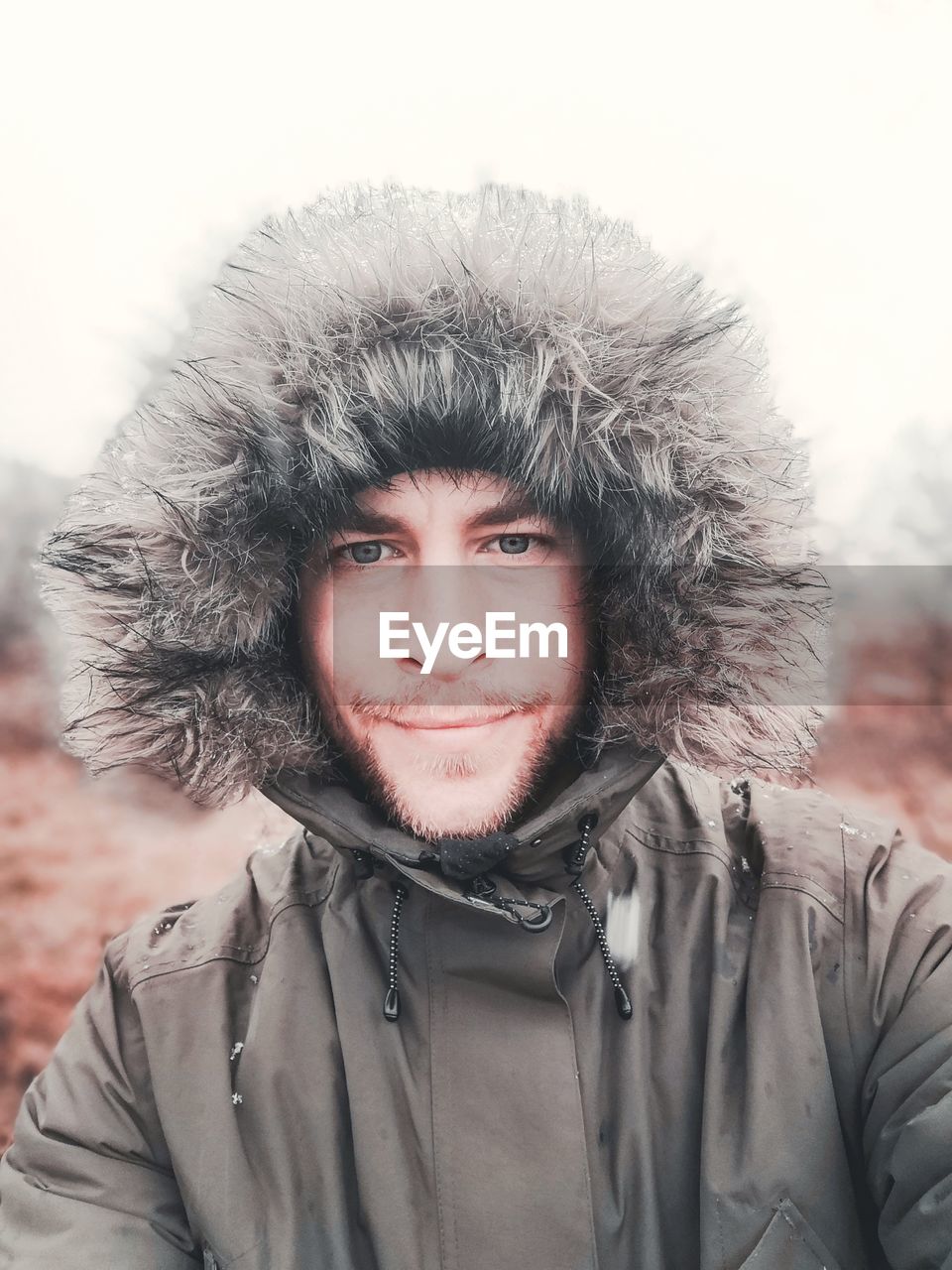 Portrait of young man wearing warm clothing during winter