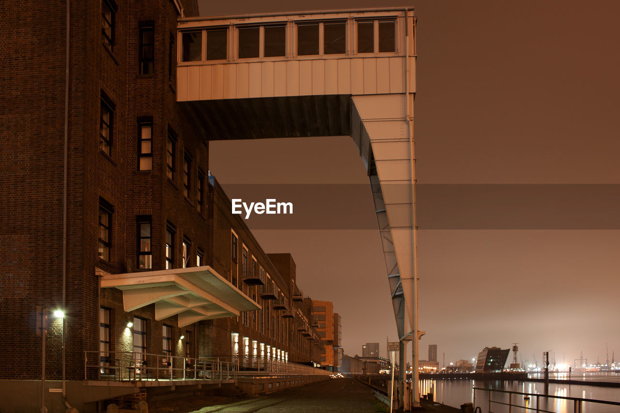 Buildings at port of hamburg against clear sky