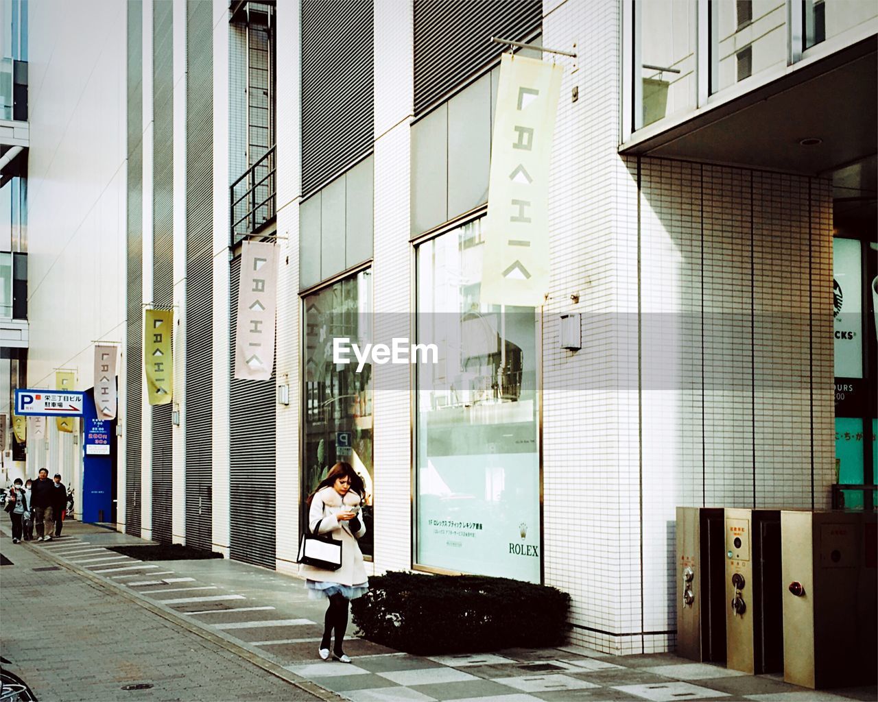 Woman walking on street