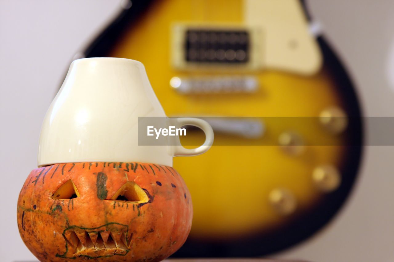 CLOSE-UP OF PUMPKIN AND TABLE