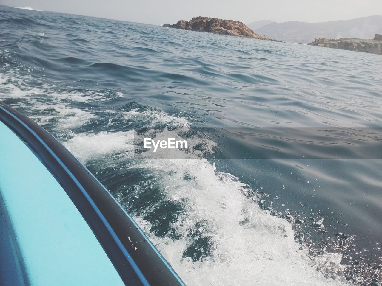 Cropped image of blue boat in sea