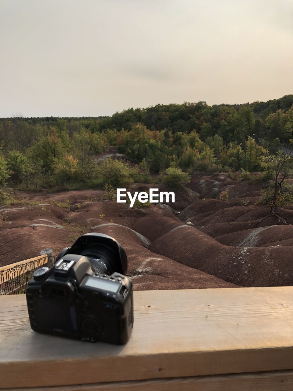 Close-up of camera on table against clear sky