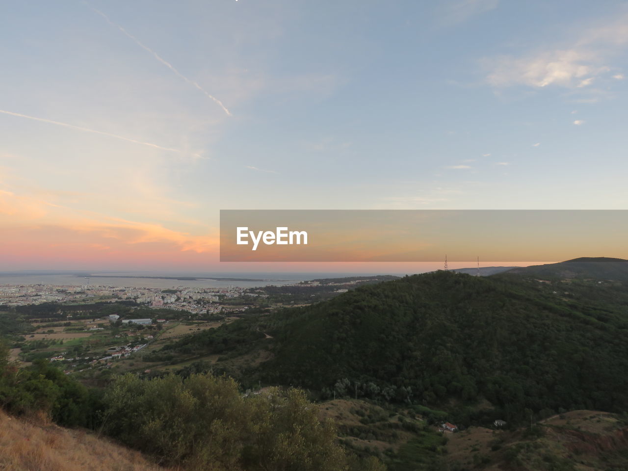 Scenic view of landscape against sky during sunset