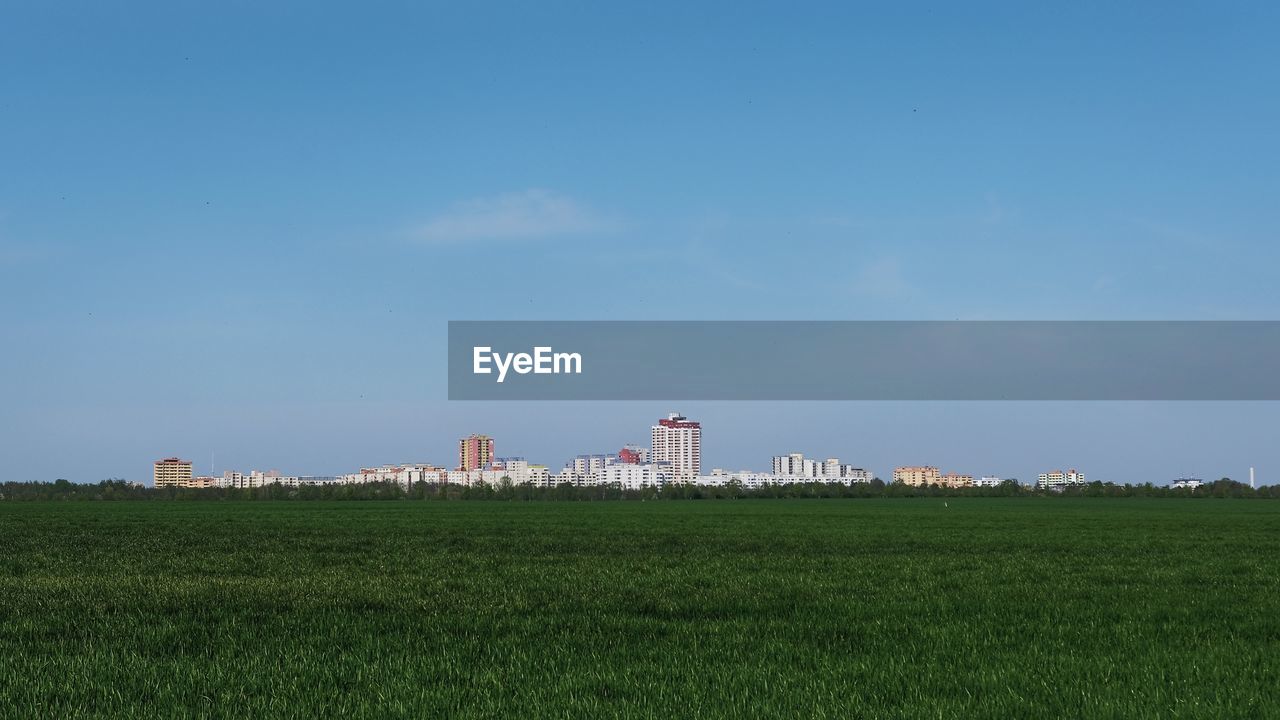 BUILT STRUCTURE ON FIELD AGAINST SKY