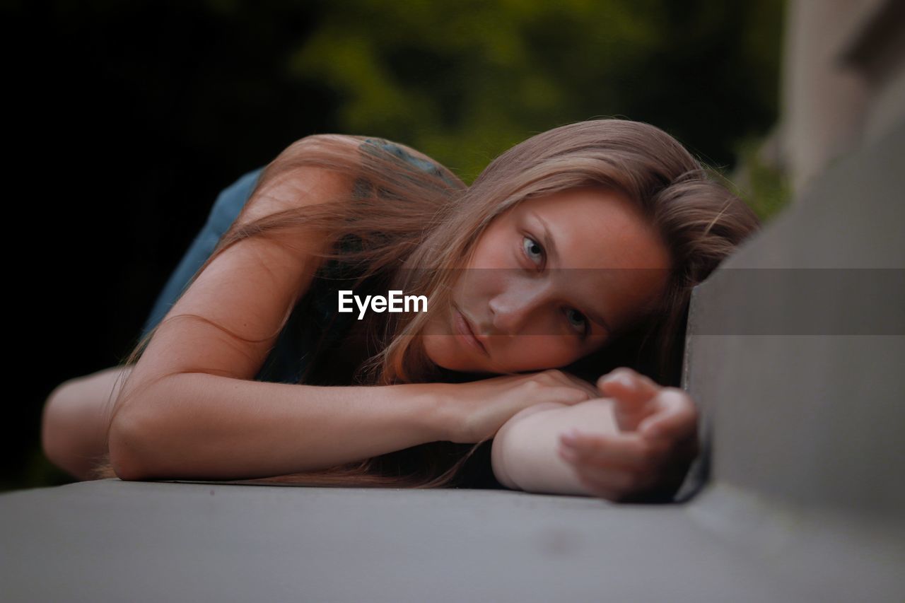 Portrait of beautiful woman lying down