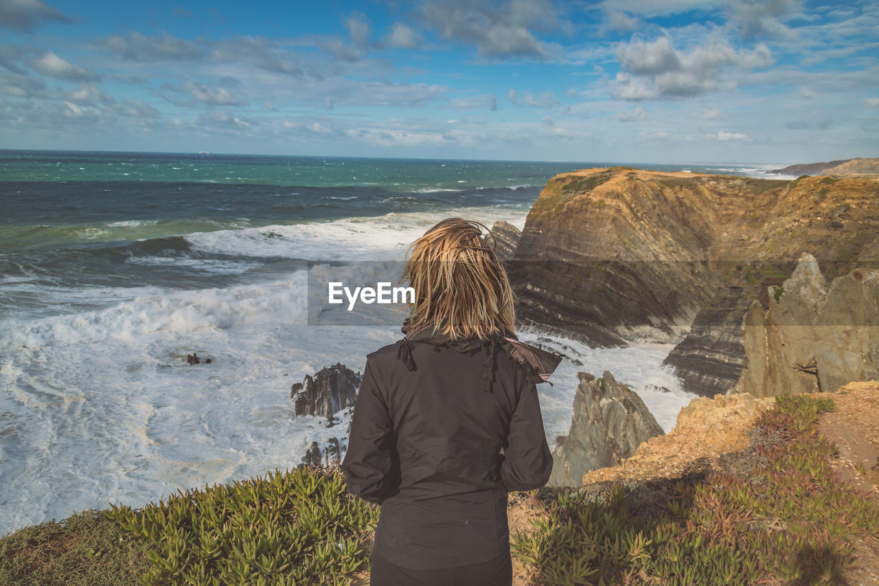 Rear view of woman on beach