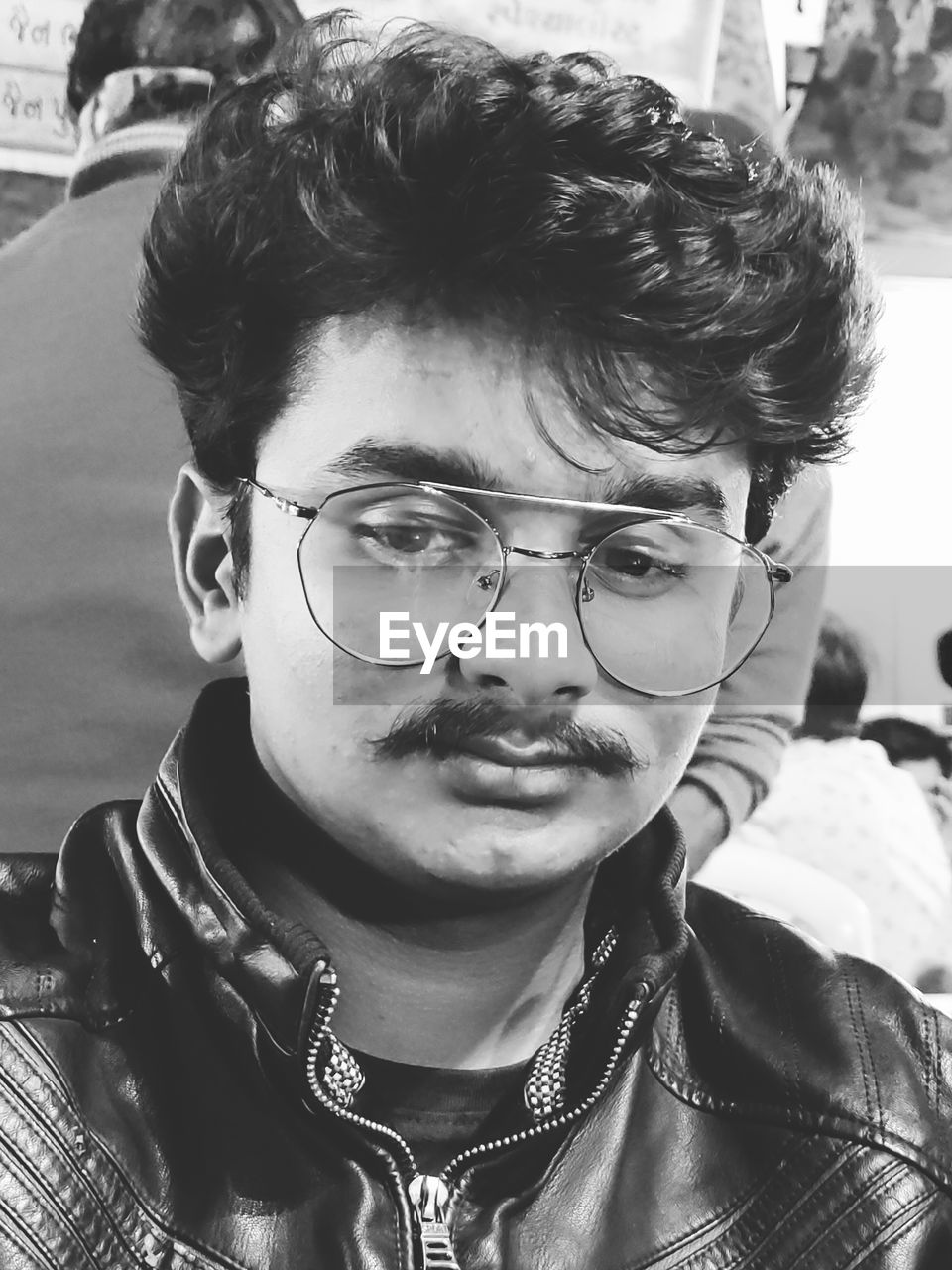 Close-up portrait of young men with eyeglasses