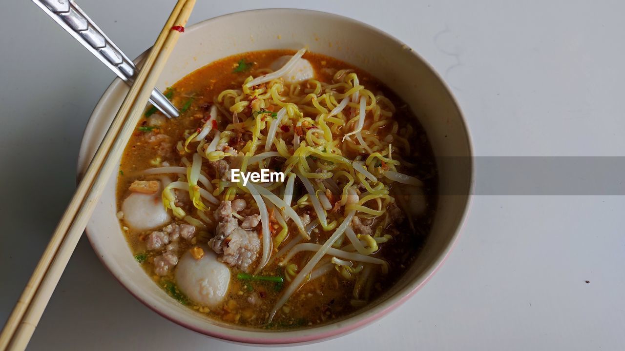 food, food and drink, healthy eating, bowl, wellbeing, dish, kitchen utensil, pasta, asian food, eating utensil, indoors, italian food, chopsticks, no people, vegetable, freshness, spoon, high angle view, cuisine, soup, thai food, meat, meal, noodle, noodle soup, studio shot, table, produce, directly above