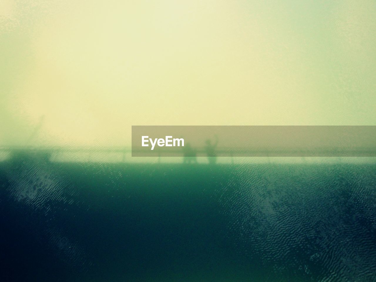VIEW OF FIELD IN FOGGY WEATHER