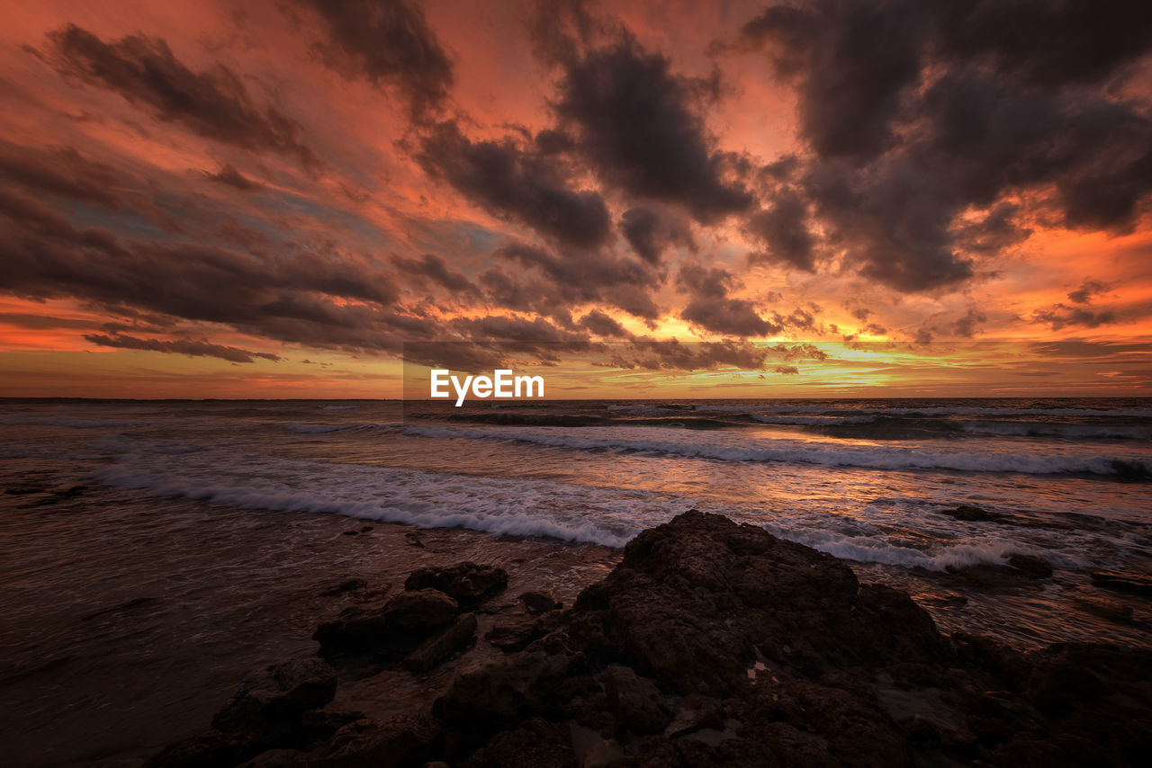 Scenic view of sea against sky during sunset