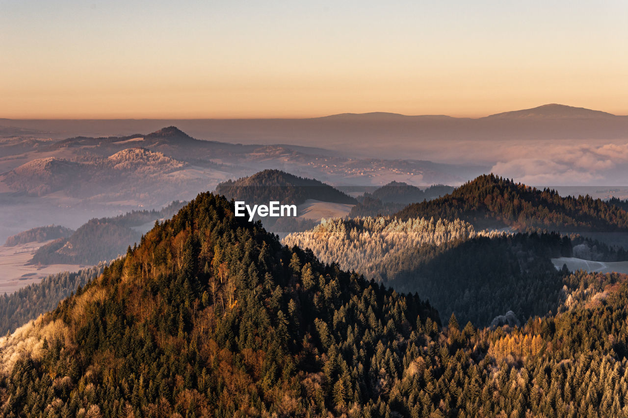 Scenic view of mountains against sky during sunset