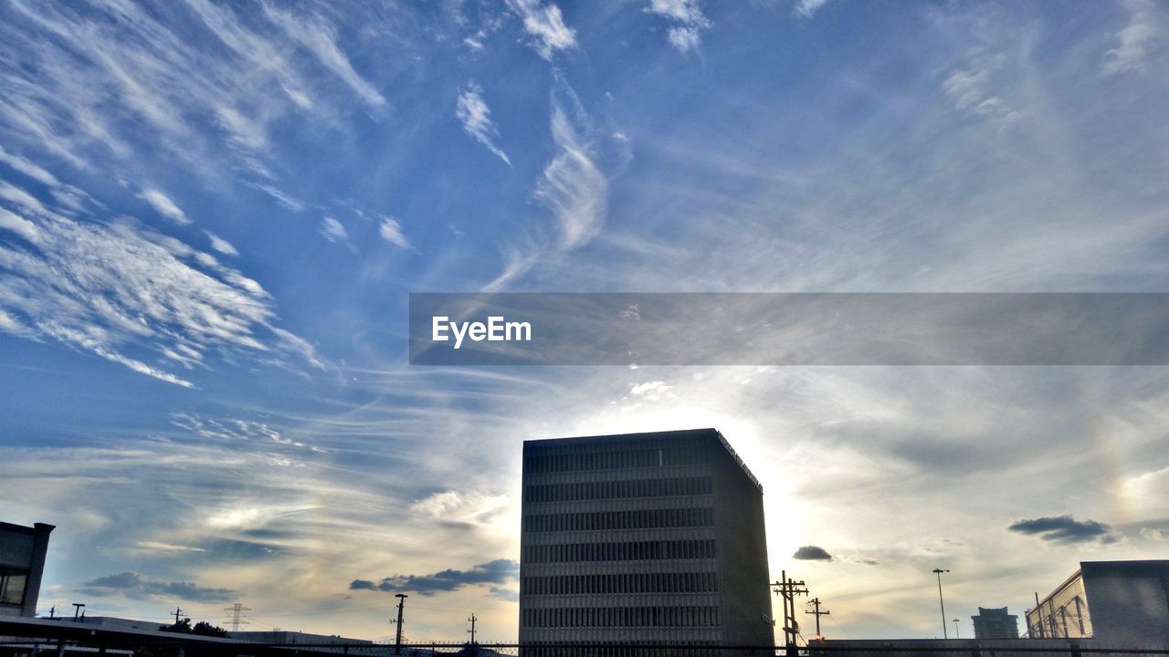 LOW ANGLE VIEW OF OFFICE BUILDING AGAINST SKY