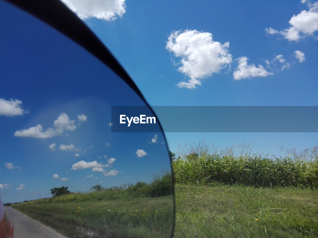 SCENIC VIEW OF LAND AGAINST BLUE SKY