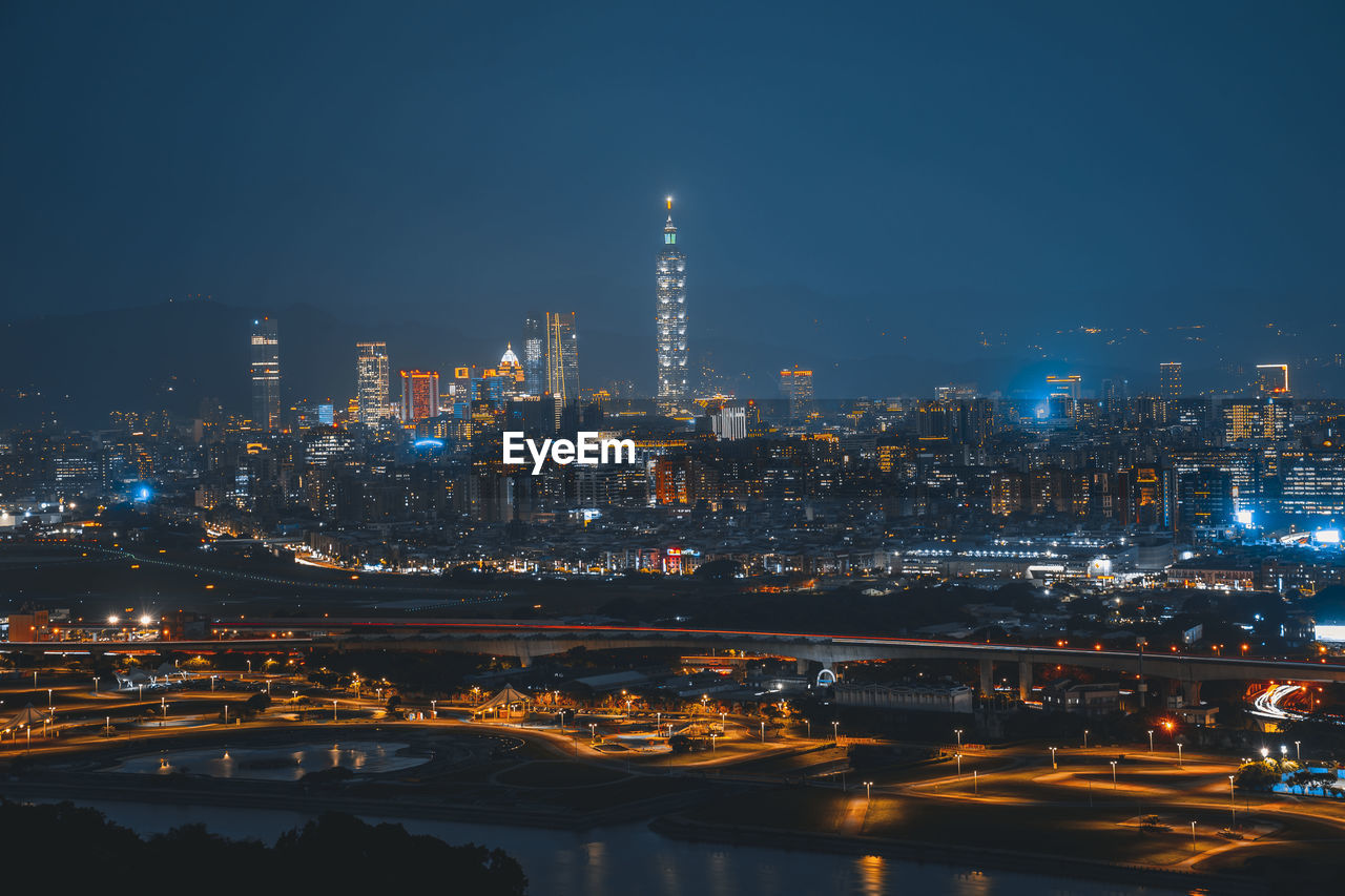 Illuminated buildings in city at night