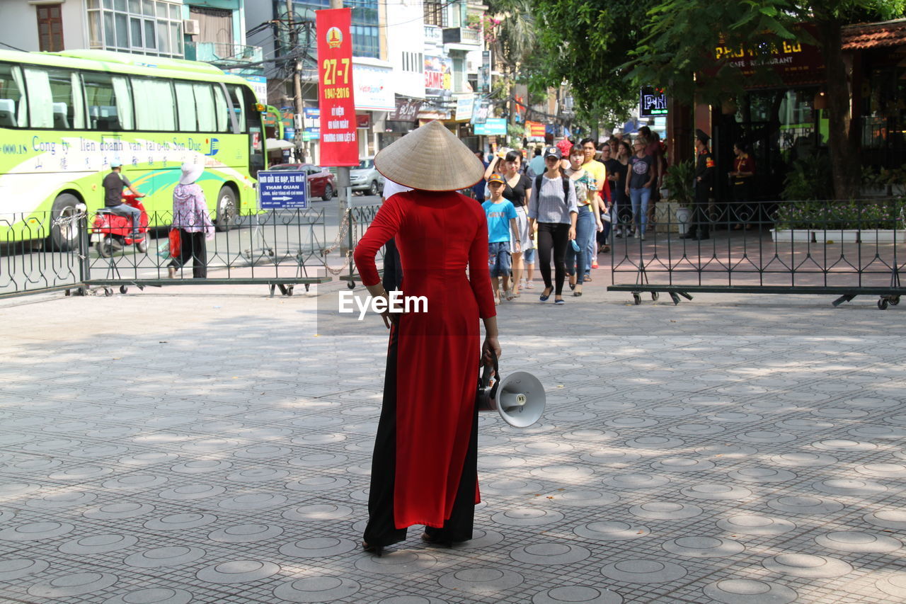 MAN WITH UMBRELLA ON STREET