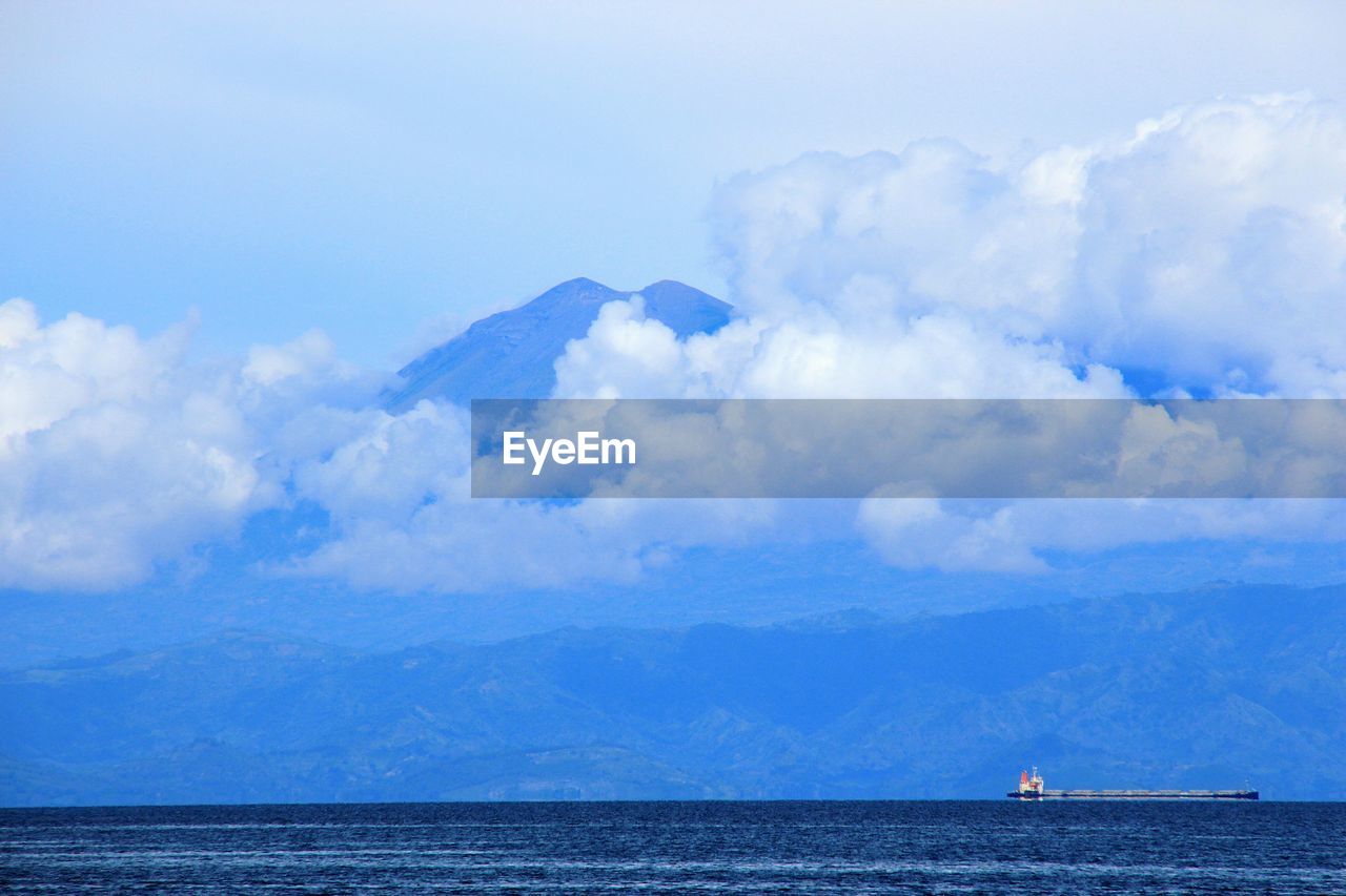 SEA AGAINST CLOUDY SKY