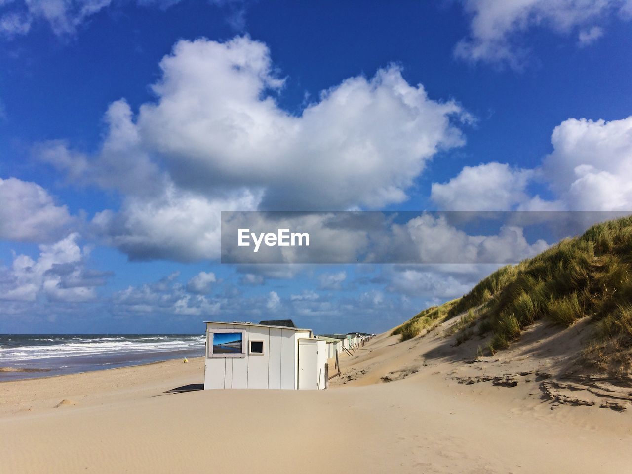 PANORAMIC VIEW OF BEACH AGAINST SKY