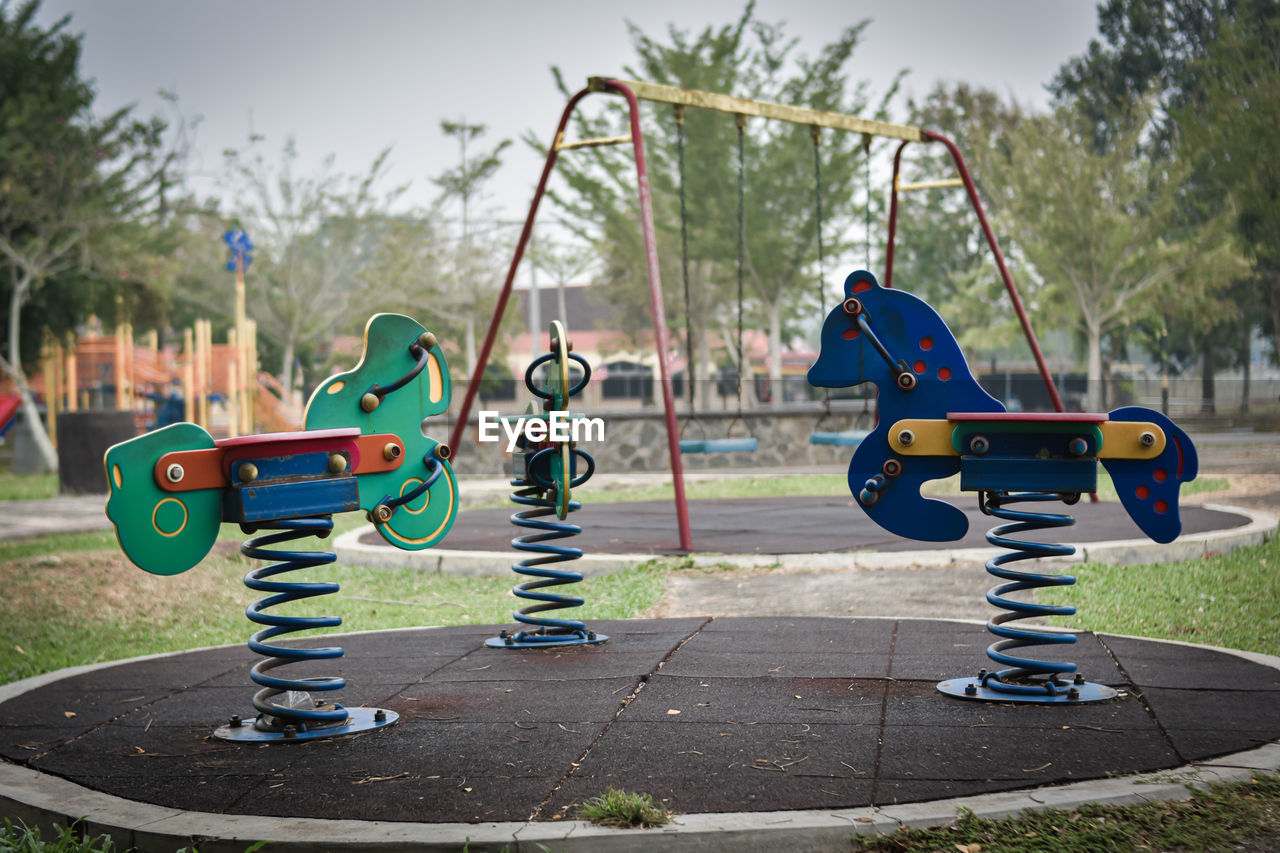 CLOSE-UP OF TOY ON PLAYGROUND