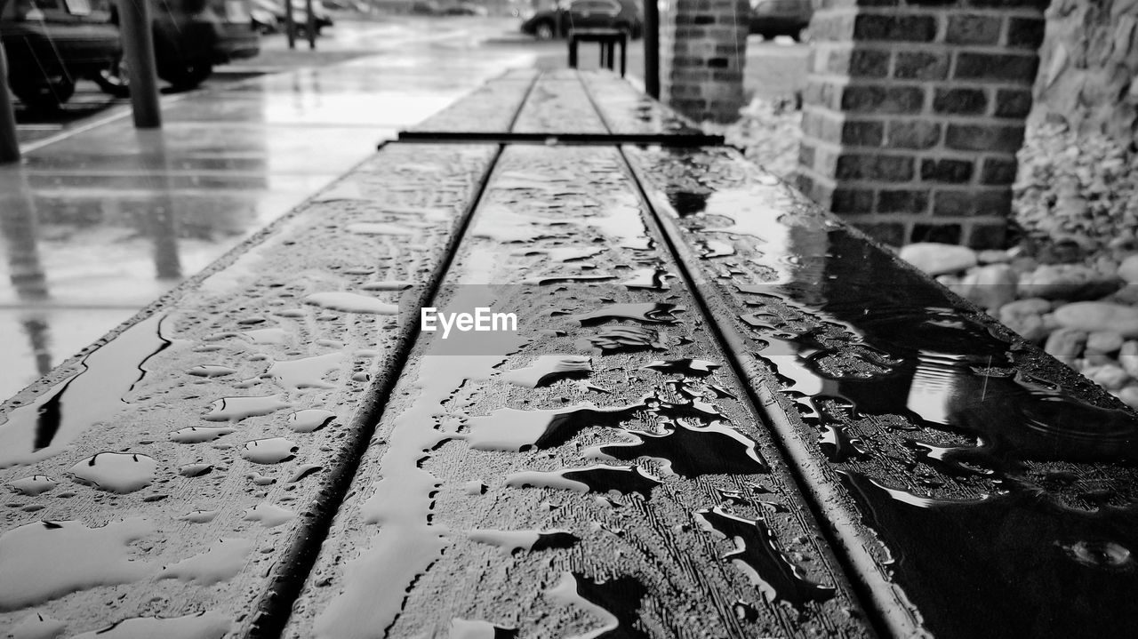 High angle view of wet bench during rainfall