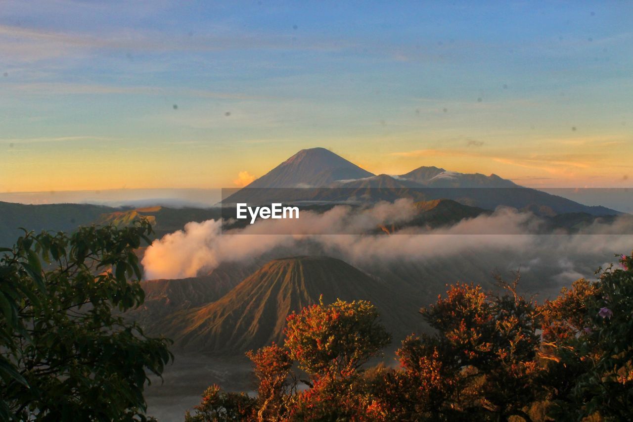 Scenic view of mount semeru and bromo against sky during sunrise