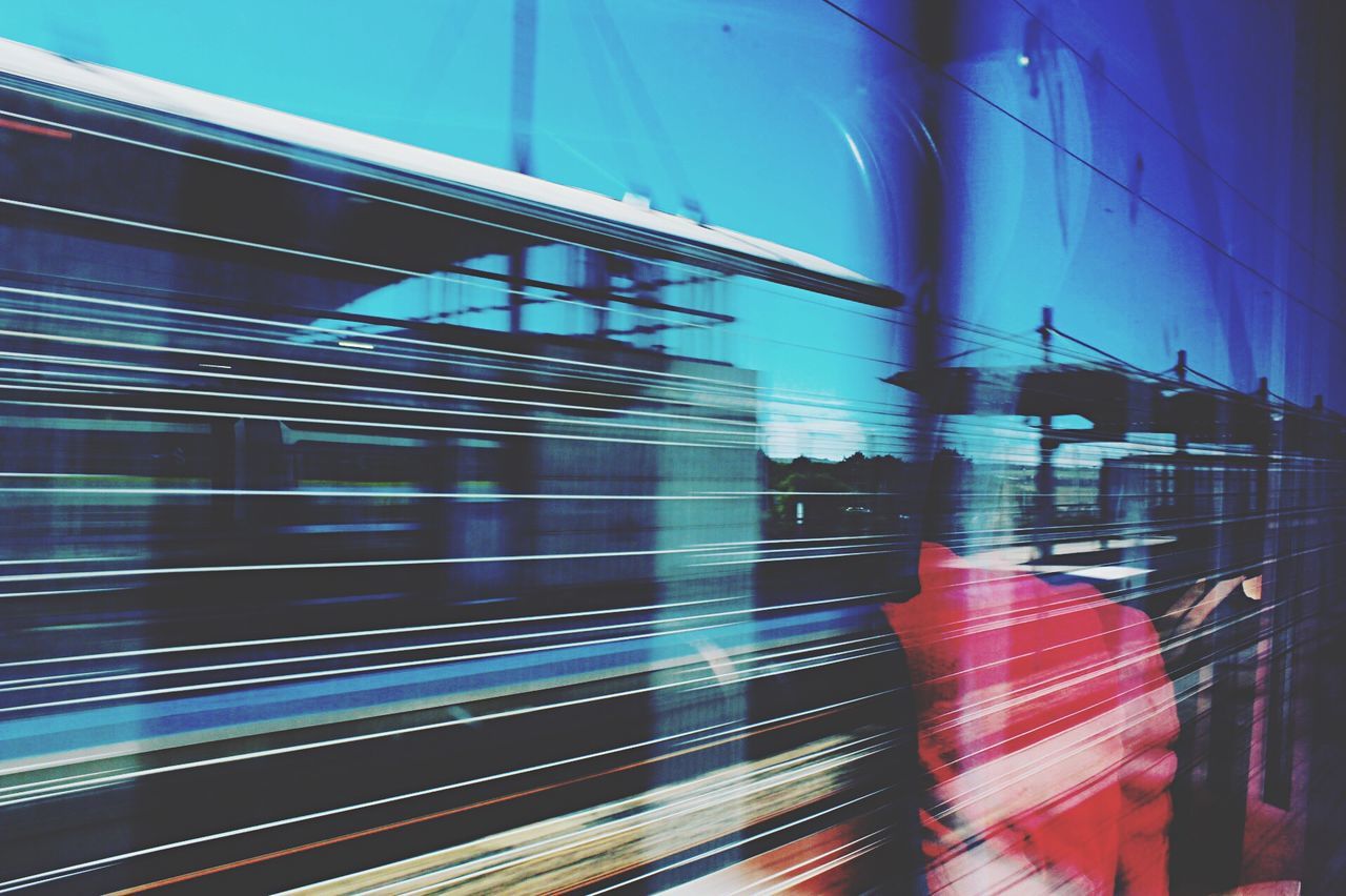 TRAIN ON RAILROAD STATION PLATFORM