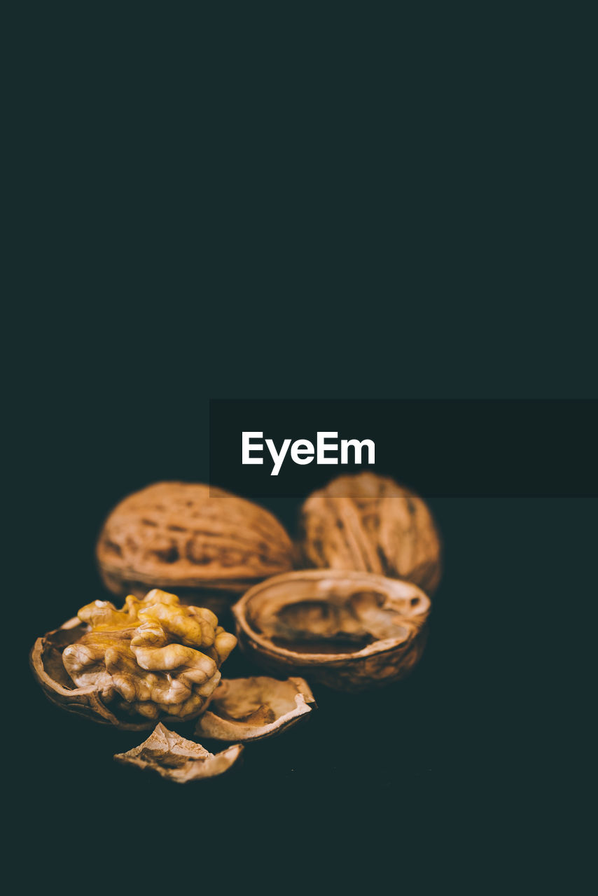 Close-up of walnuts against black background