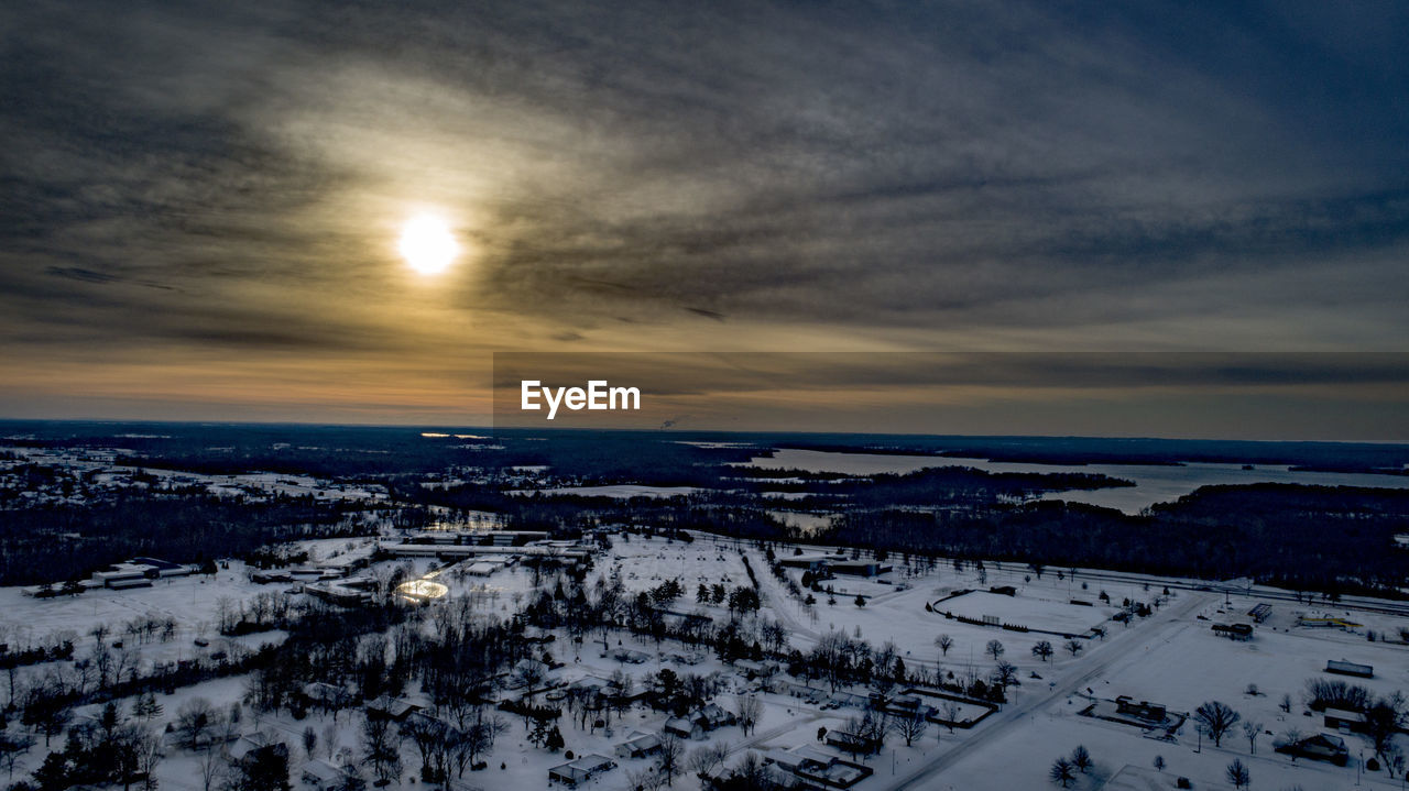 HIGH ANGLE VIEW OF BUILDINGS DURING WINTER