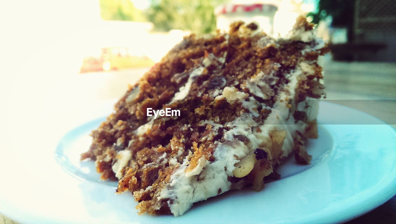 Slice of carrot cake served on plate